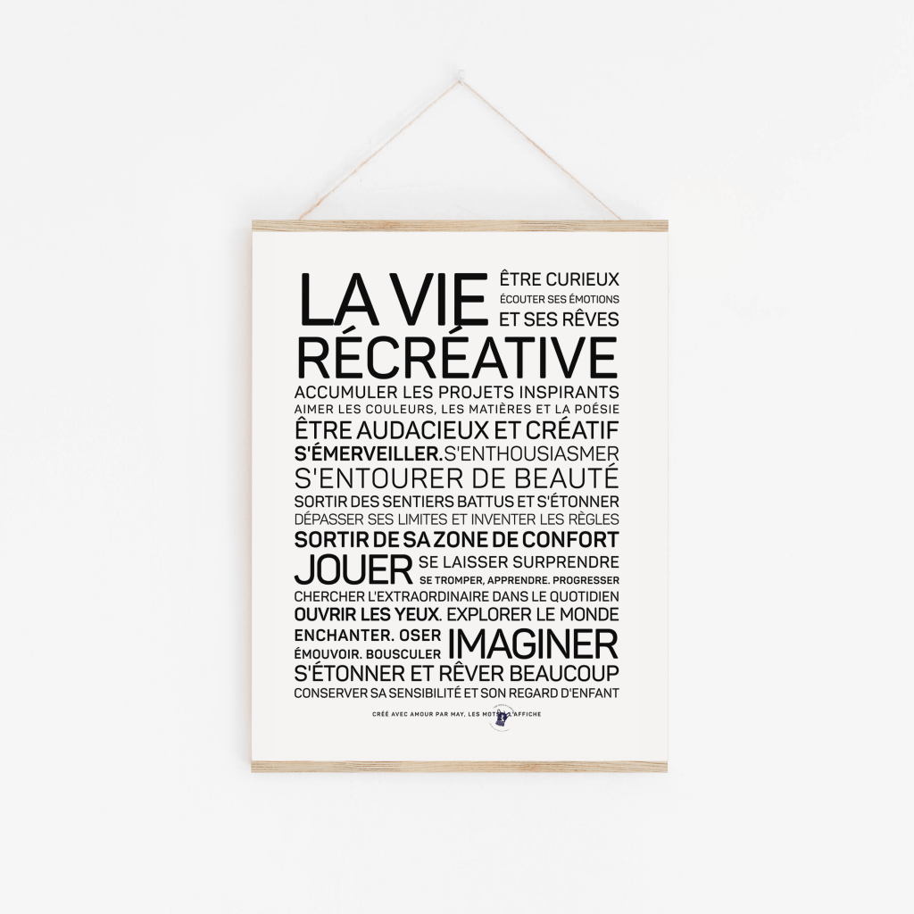 Une affiche avec les mots La Vie Créer accrochée au mur.