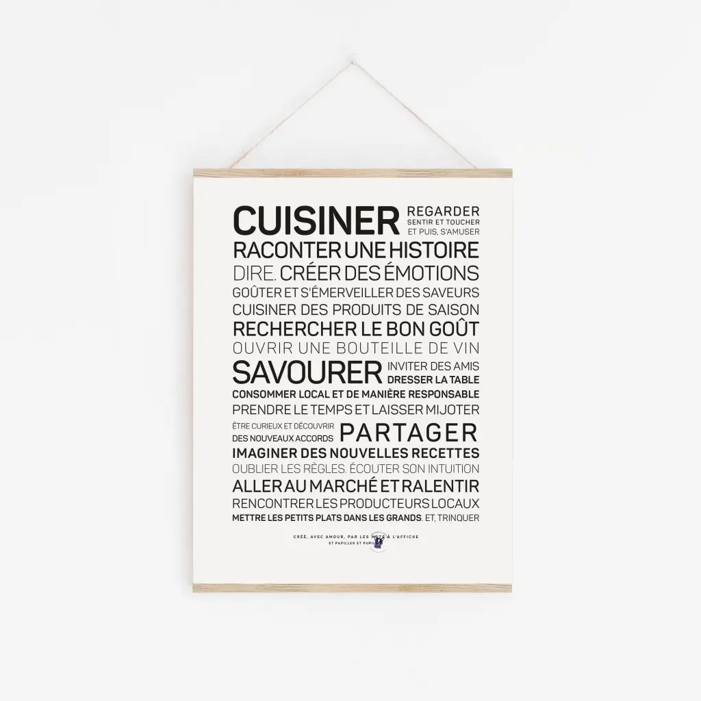 Une affiche en noir et blanc avec le mot « Cuisiner » dessus.
