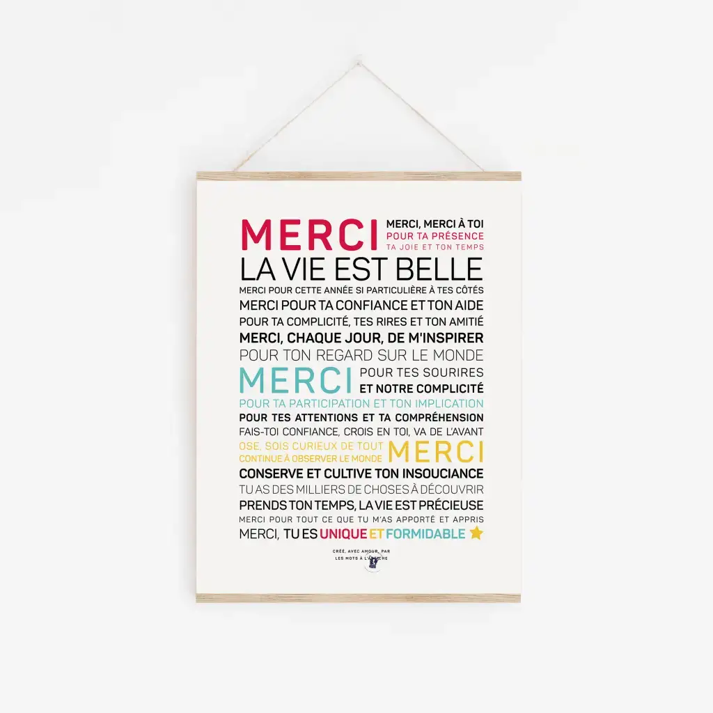 Une affiche Merci, la vie est belle (encouragements) avec les mots « miséricorde » dans différentes langues accrochée à un mur.