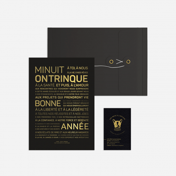 Une invitation noir et or avec une Letter press : Minuit, sur enveloppe dorée thème trinque.