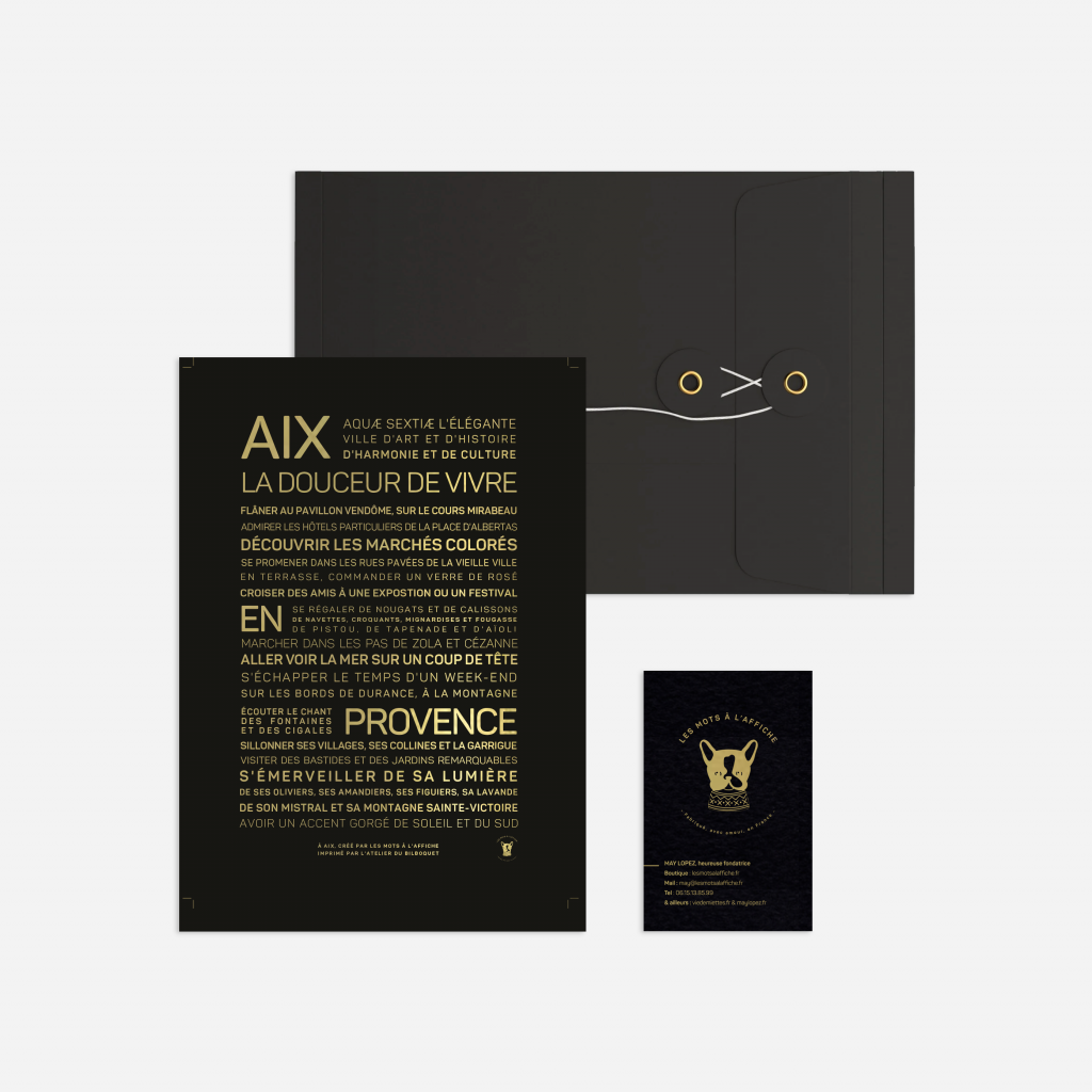 Présenté sur un fond blanc, Letter press : Aix en Provence comprend une enveloppe noire à attache, une impression typographique Aix-en-Provence noire et dorée et une petite carte noire avec un emblème doré - une idée cadeau élégante pour toute occasion.