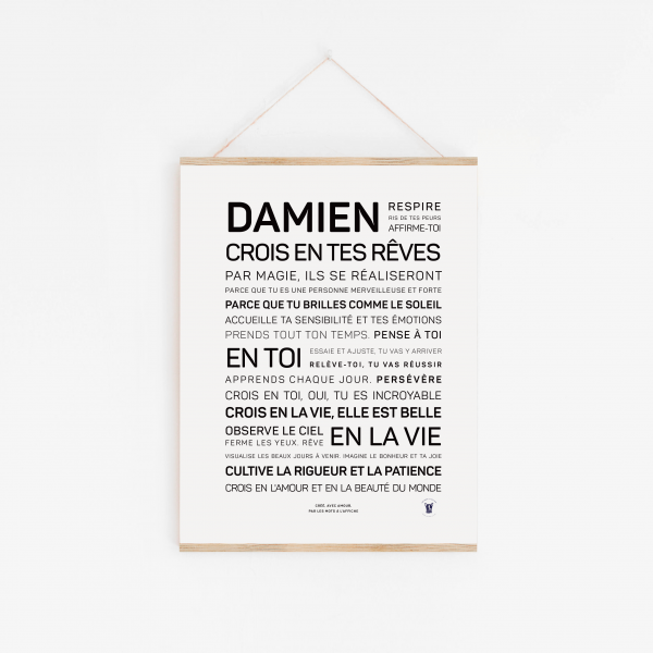 Une affiche avec les mots 'Damien, crois en tes rêves' en noir et blanc, une idée cadeau inspirante.