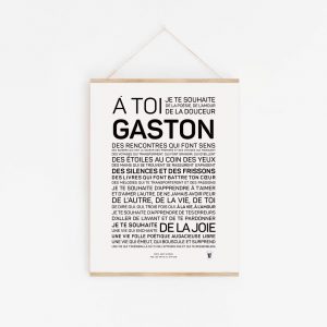 Une pancarte blanche avec un Gaston inspirant sur un mur blanc.