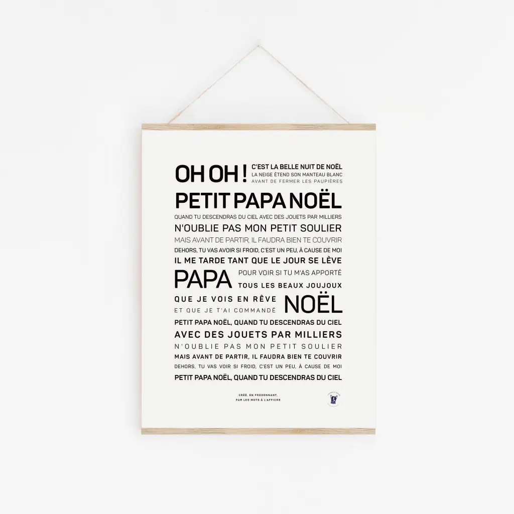 L'affiche encadrée "Petit papa noël" présente les paroles en français sur fond blanc—une idée cadeau idéale pour les fêtes, cette affiche ajoutera une note festive à votre intérieur.
